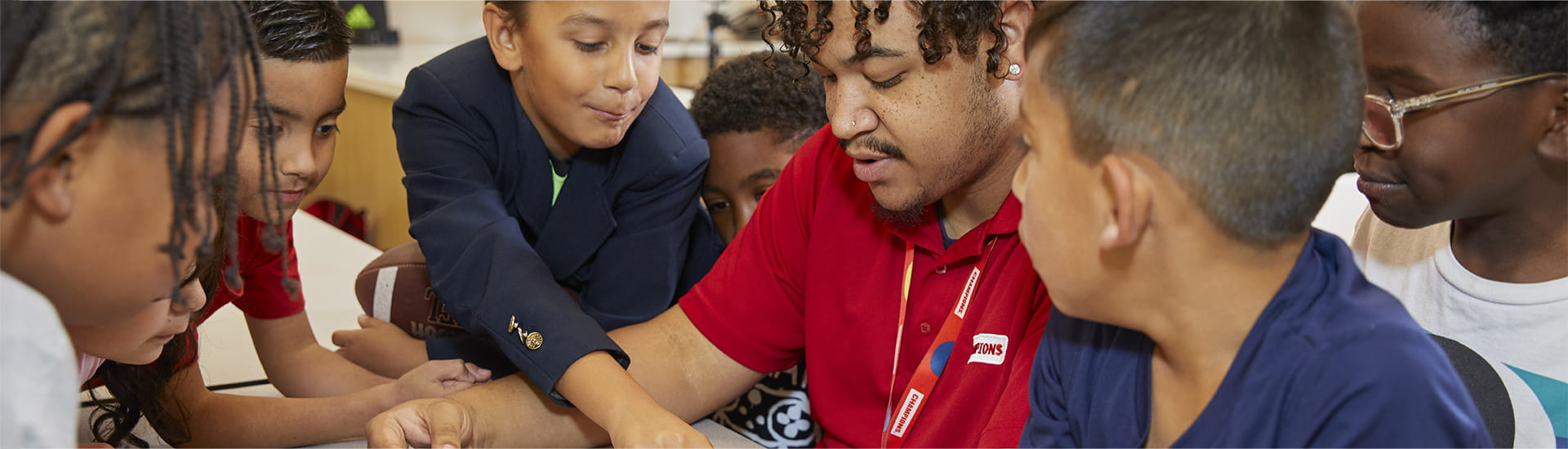 teacher helping students with homework
