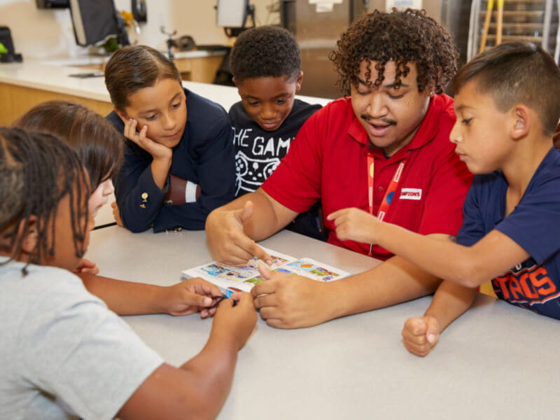 Champions teacher with kids