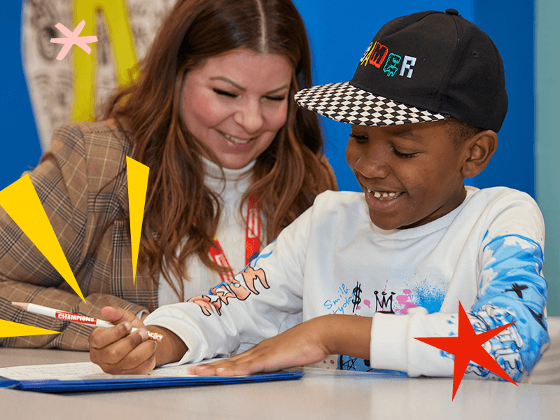 teacher helping student with homework