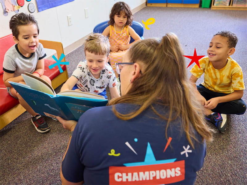 kids reading with the teacher