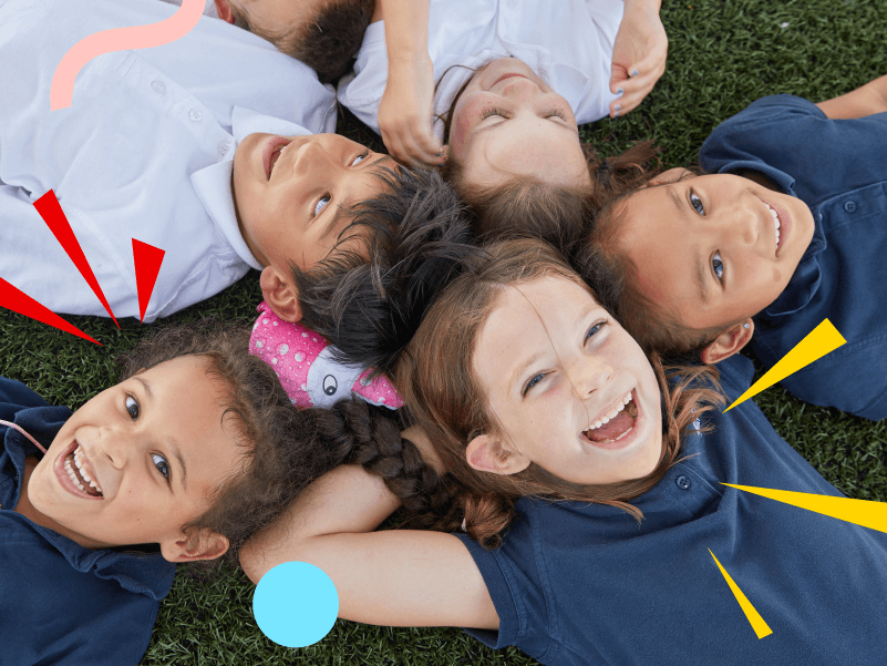 kids laying in grass