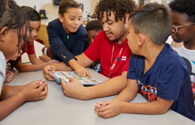 Champions teacher with kids