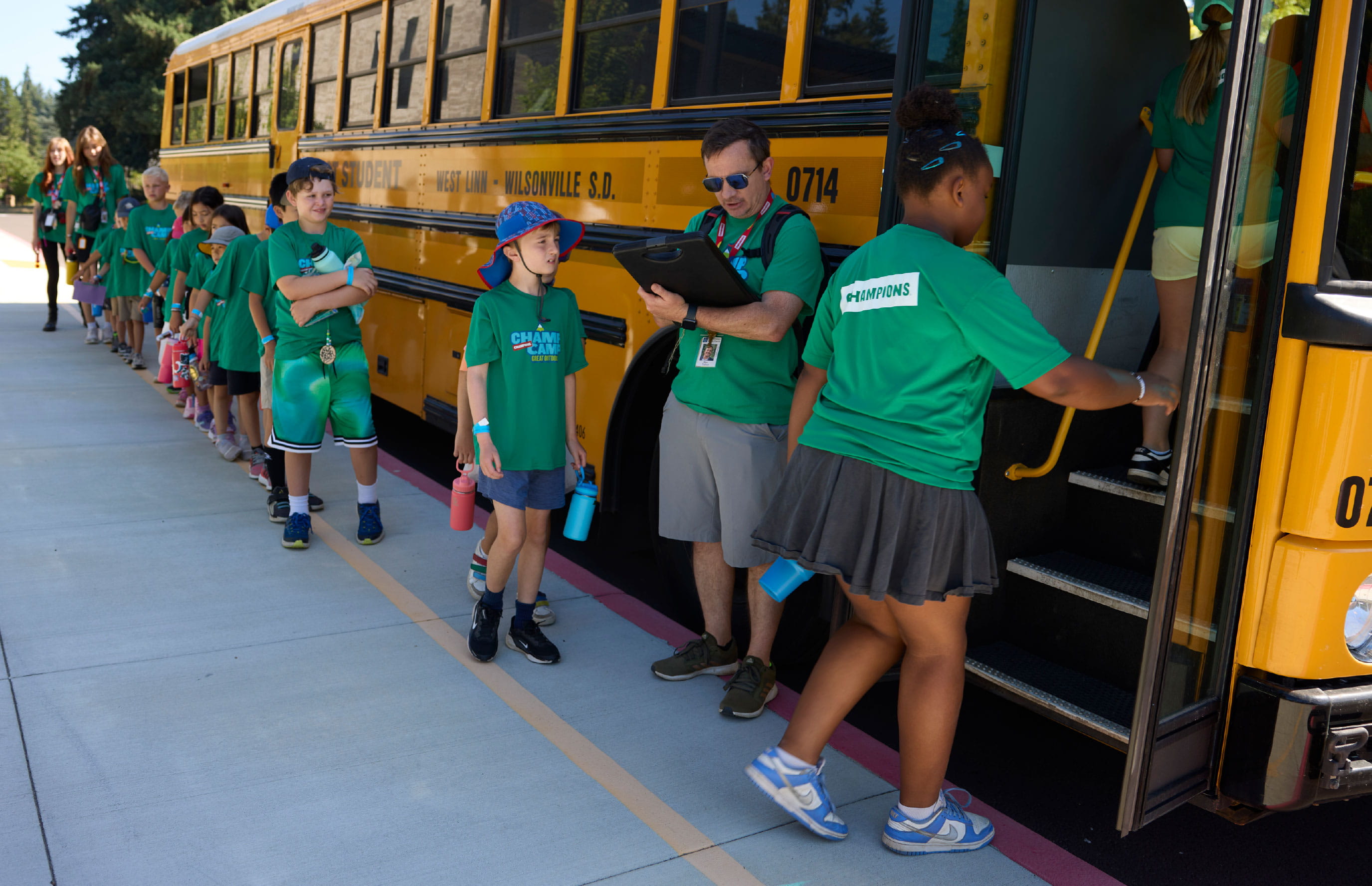 Kids on the bus at champ camp collabs